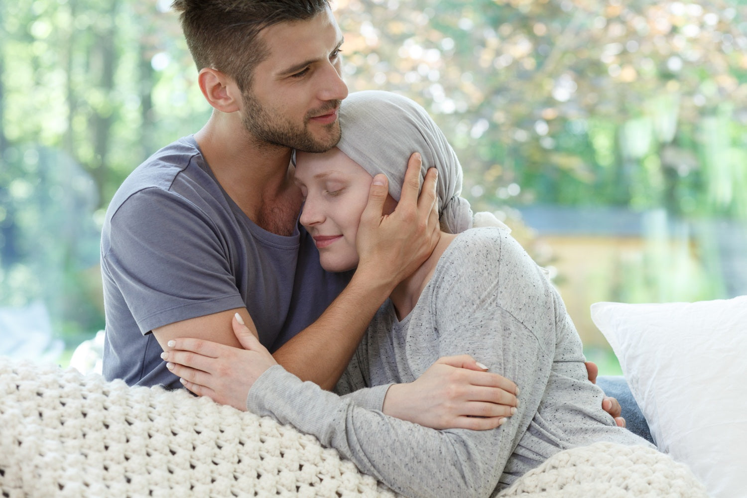 Man holding woman who is dying