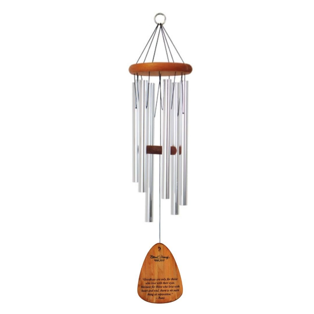A hanging wind chime with multiple silver metal tubes, a round wooden top, and a wooden engraved sail engraved with: "Goodbyes are only for those who love with their eyes. Because for those who love with heart and soul there is no such thing as separation."  Image displayed on a plain white background.