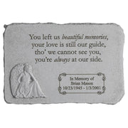 A rectangular stone memorial engraved with a message about memories and love, featuring an angel sculpture. It includes the name Brian Mason, along with his birth and death dates.
